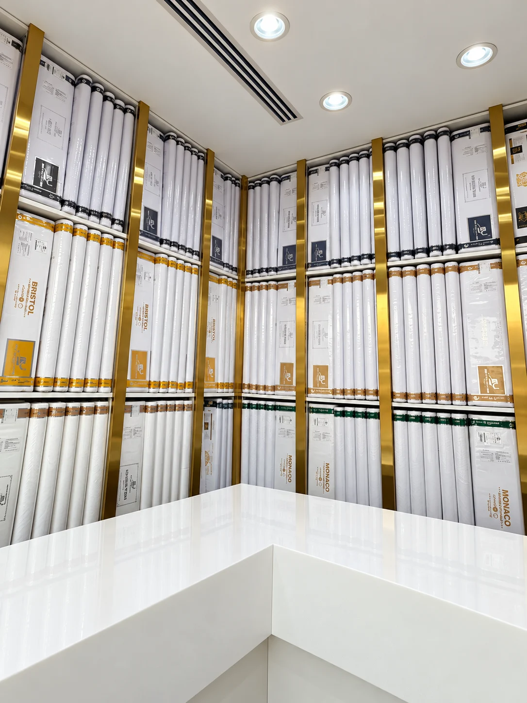 Al Khalid Stores thobe fabric displays with a clean showroom counter